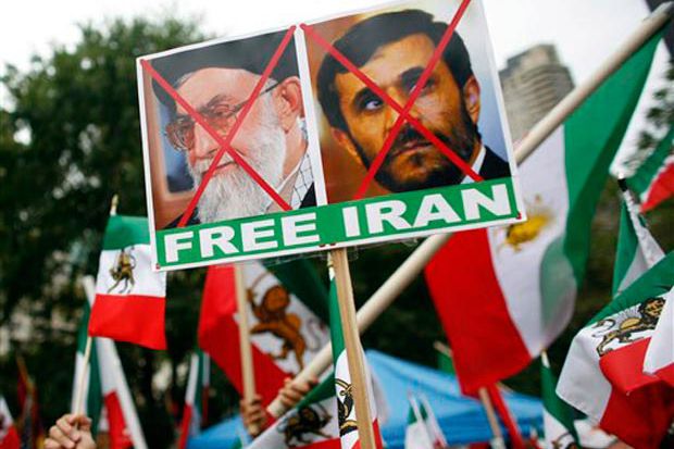 Protesters carried signs outside the UN during Iranian leader Mahmoud Ahmadinejad's speech